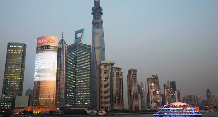 The Shanghai Tower soars above its neighbors on the Pudong skyline in Shanghai. When completed next year, the 2,073-foot-tall tower will officially become the world’s second-tallest building. John J. Kim, Tribune photographer