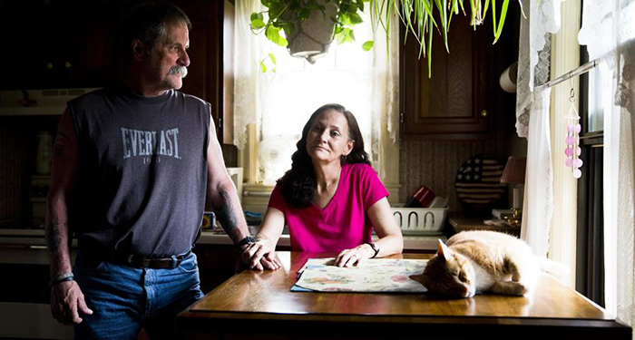 David and Barbara Ludwig pose for a portrait at their home Wednesday, May 28, 2014, in Reading, Pa. The Ludwigs lost their manufacturing jobs and have been struggling financially ever since. (AP Photo/Matt Rourke)