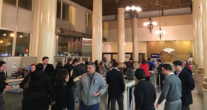 Group of people chatting at the gallery opening