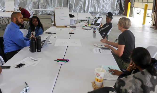 Group of people chatting at a table