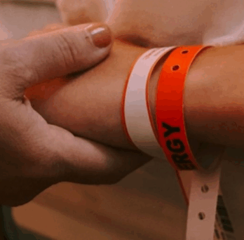 Someone holding the arm with a hospital wristband, Credit: Jon Tyson, via Unsplash 
