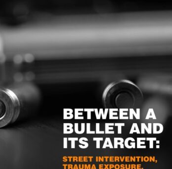 Cover of the report Between a Bullet and Its Target: Street Intervention, Trauma Exposure, and Professional Implications featuring a dark background with blurred metallic imagery. 