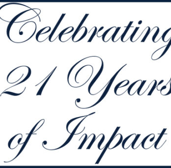 Graphic with cursive text reading “Celebrating 21 Years of Impact” on a white background with a blue border. 