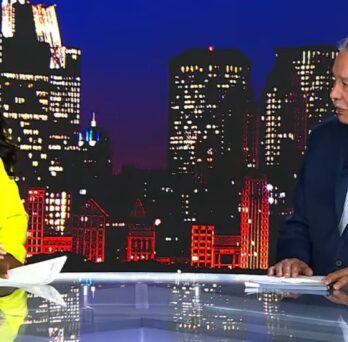 FOX 32 Chicago host interviews Great Cities Institute researcher Juan González in the studio, with the Chicago skyline behind them. 