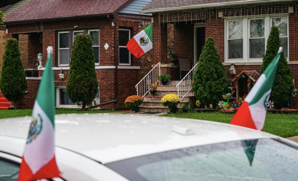 Mexican flags hang from a house and a car on the 2700 block of N Major Ave in Belmont Cragin on Sept. 16, 2026. Credit: Giacomo Cain/Block Club Chicago